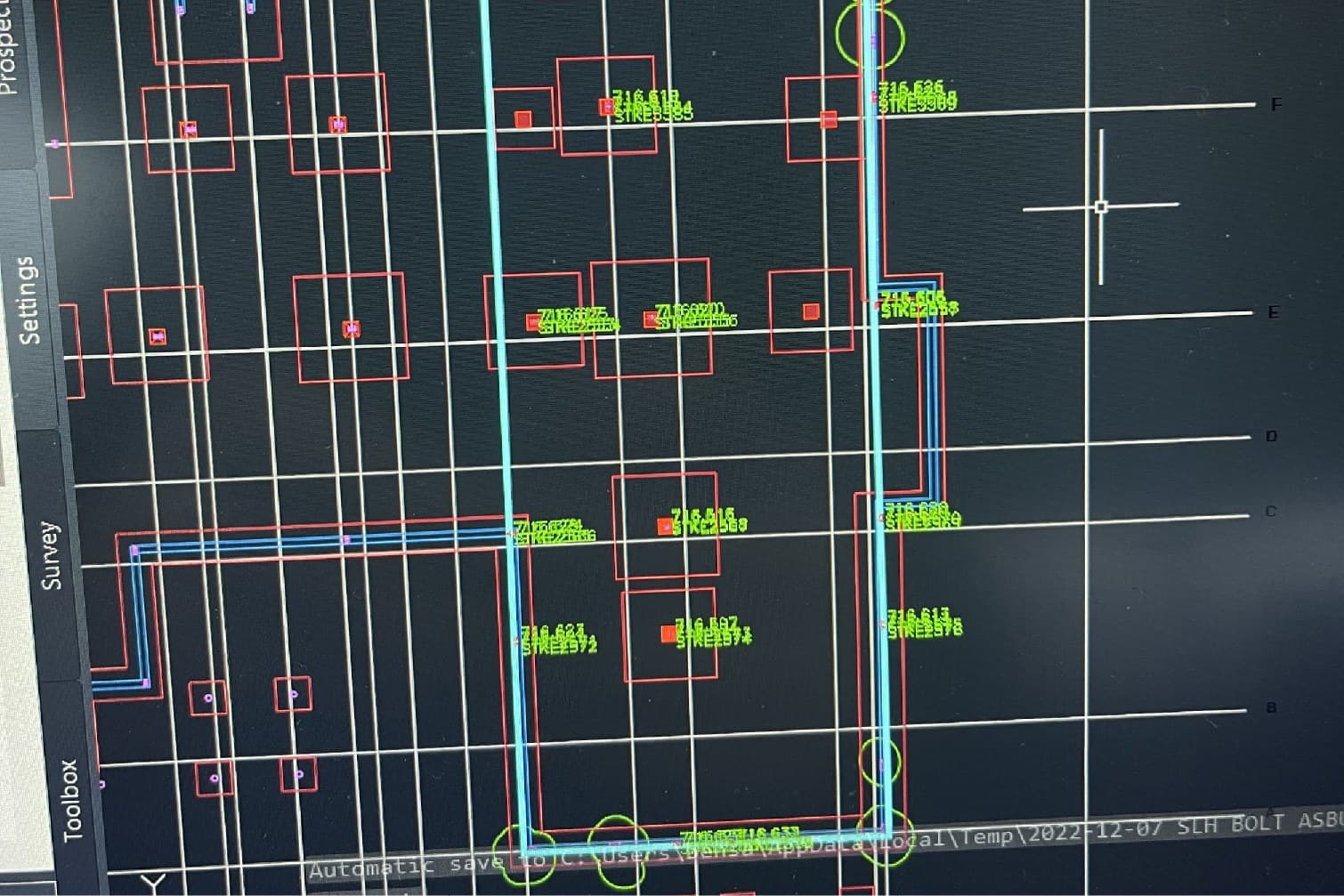 CAD screen showing surveyed anchor bolt positions against the design grid