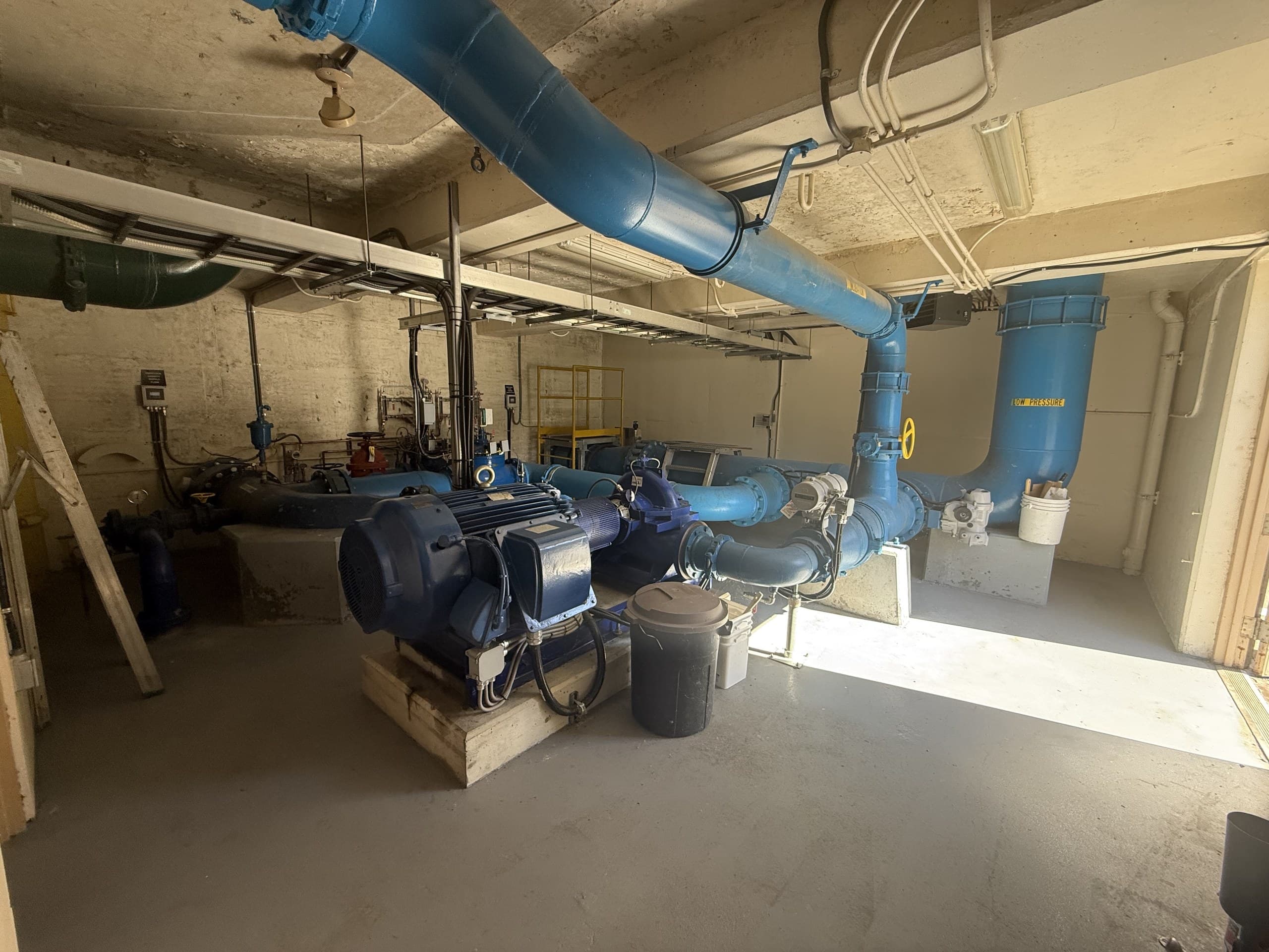 Pump station interior with large-diameter piping measured for engineering records