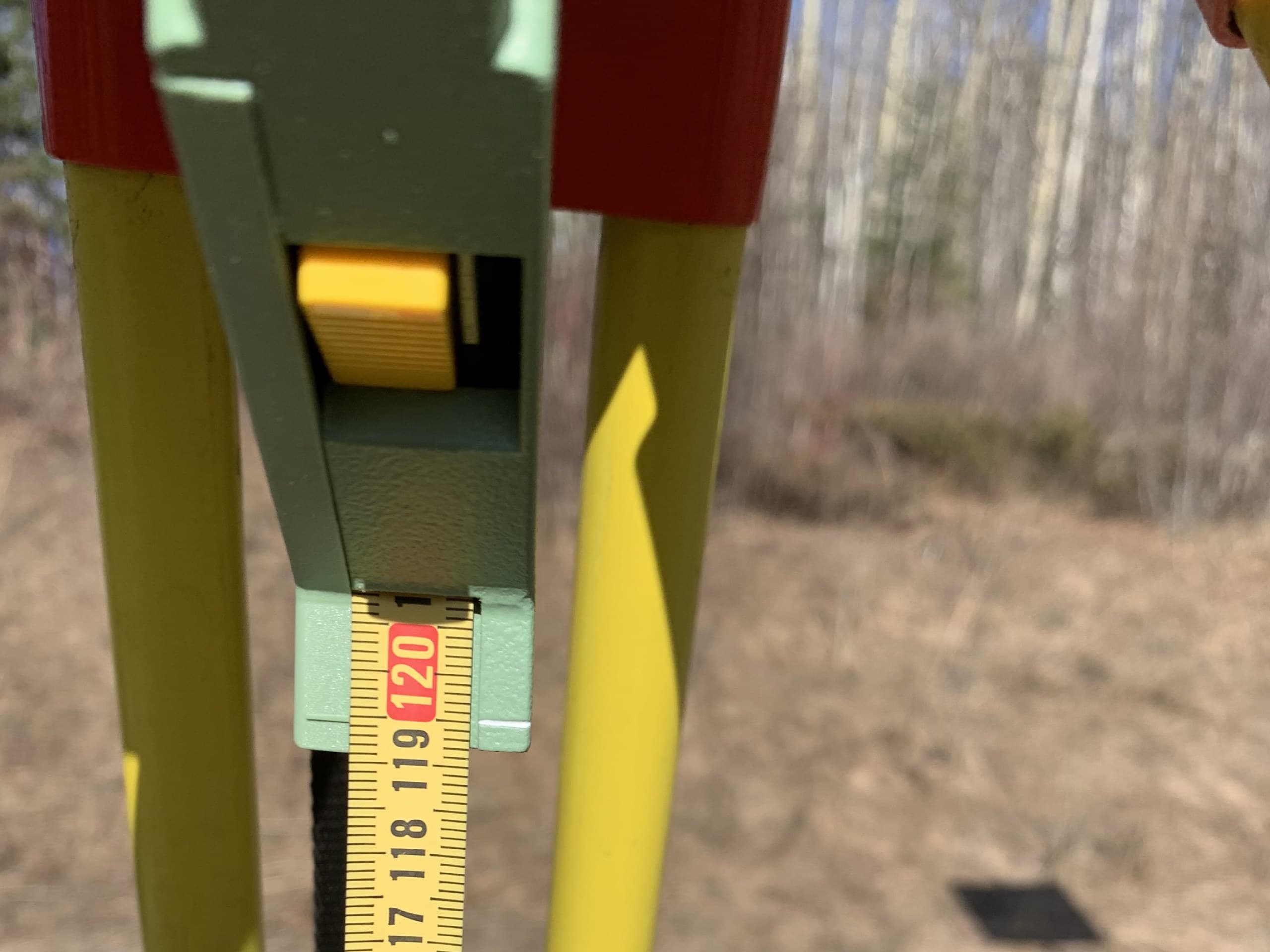 Instrument height tape reading on a survey tripod